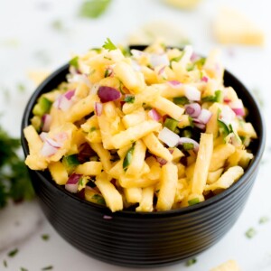 pineapple pico de gallo in a black bowl