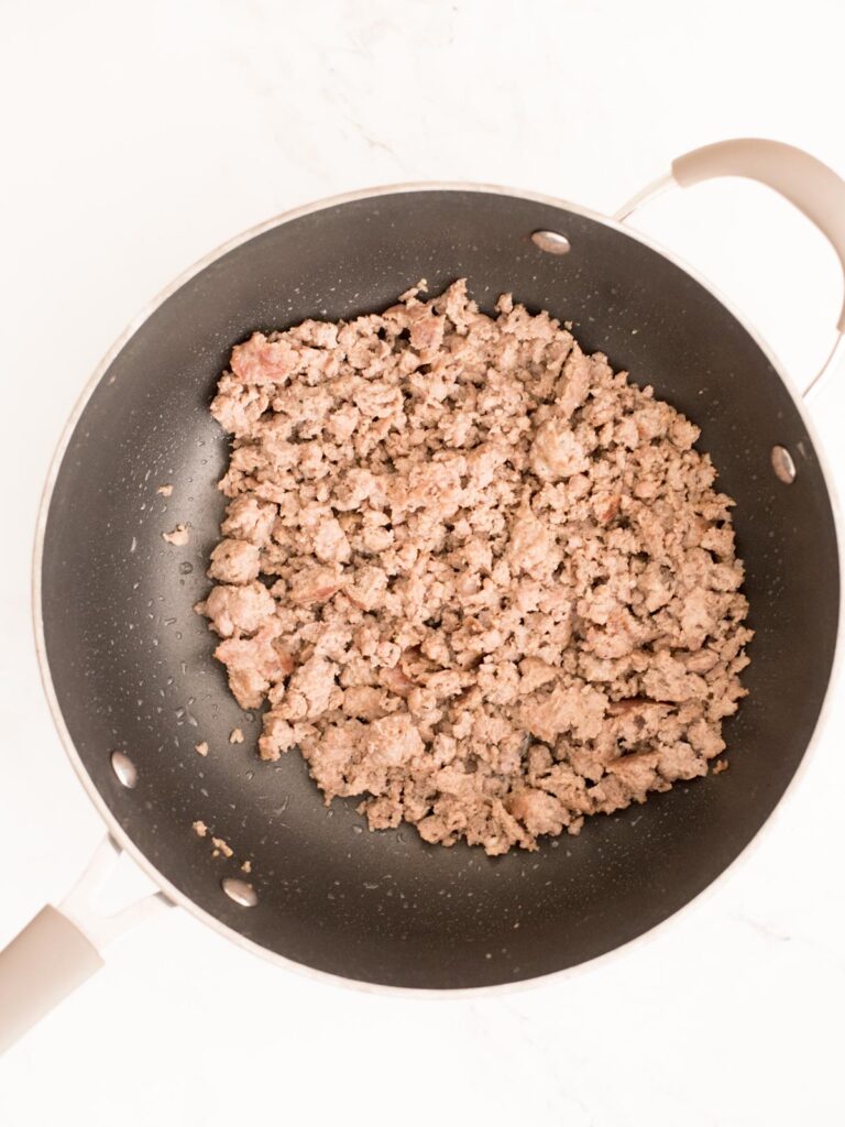 breakfast sausage cooked in a skillet