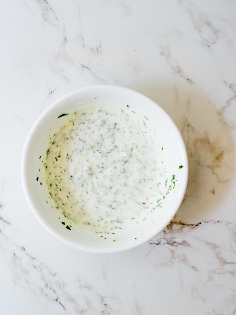 creamy cilantro lime sauce mixed together in a bowl