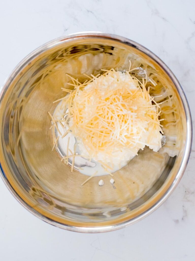 cottage cheese and parmesan in a mixing bowl
