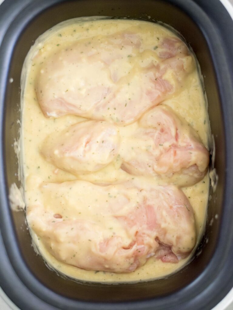 chicken added to the crockpot