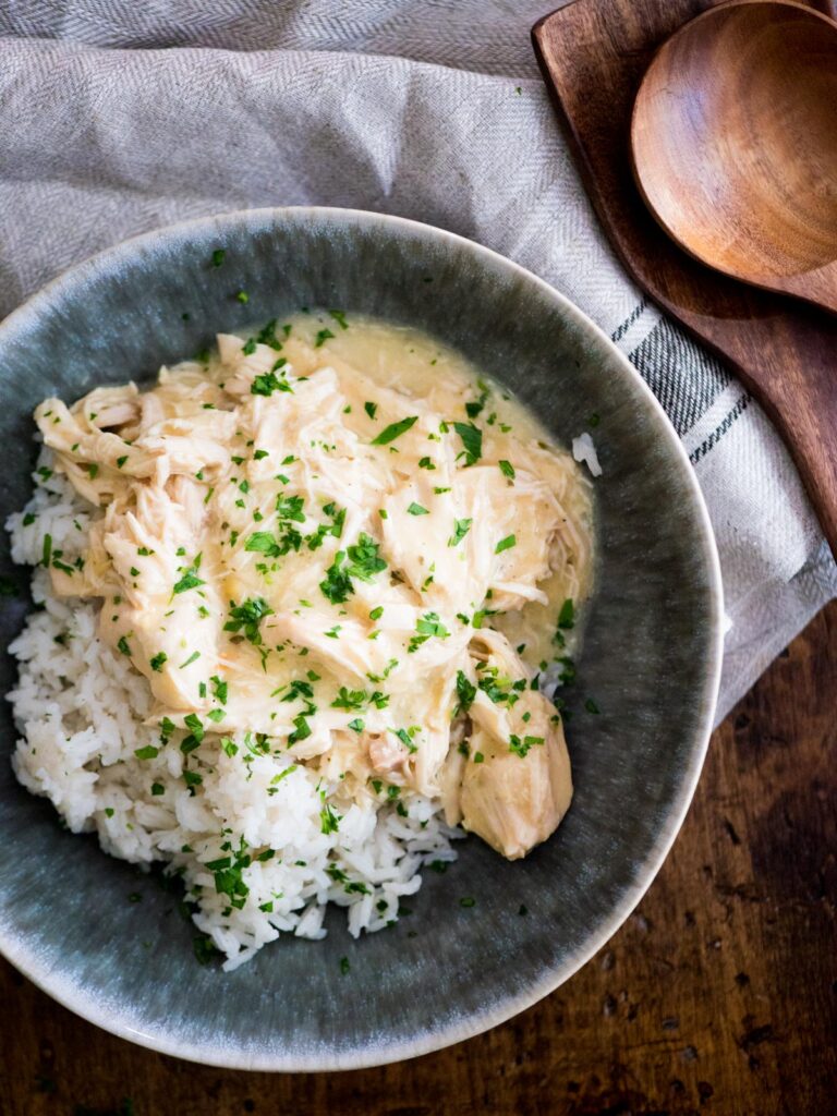 crockpot ranch chicken over rice sprinkled with parsley