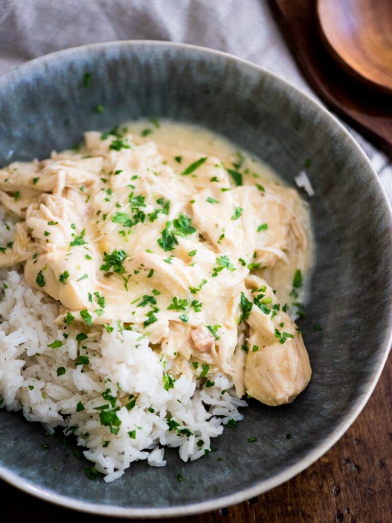 crockpot ranch chicken over rice sprinkled with parsley