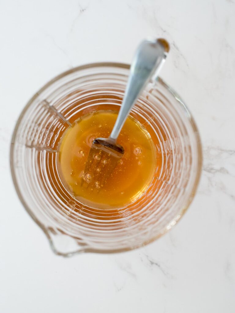 honey in a measuring glass