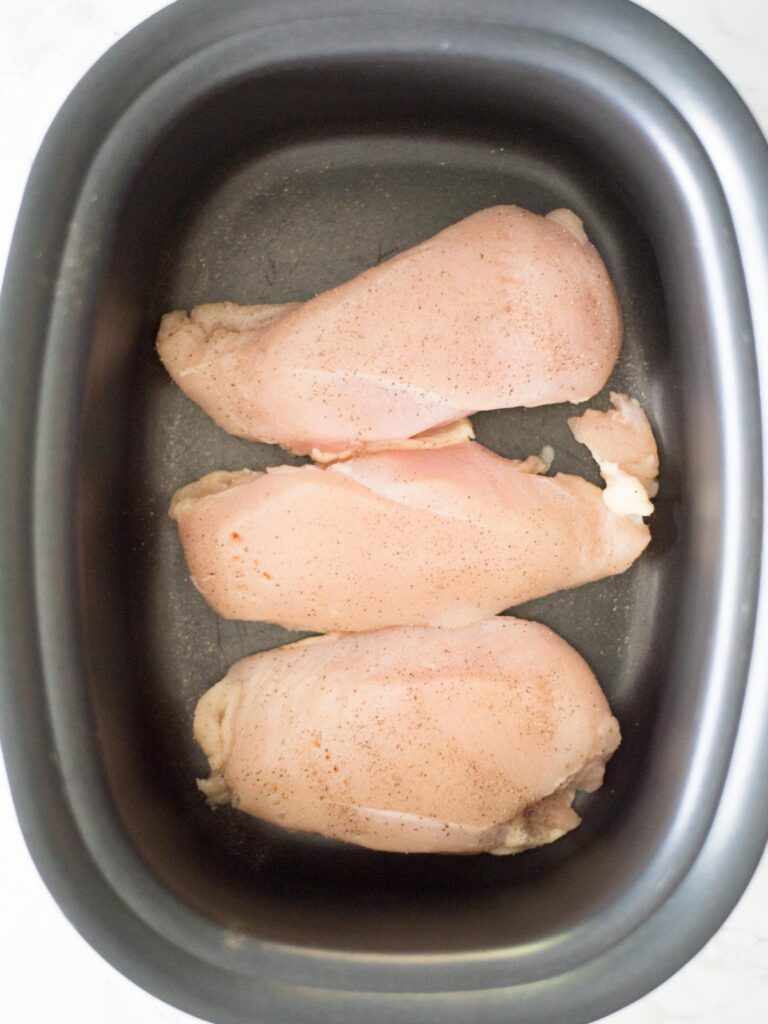 Seasoned chicken in the crockpot.