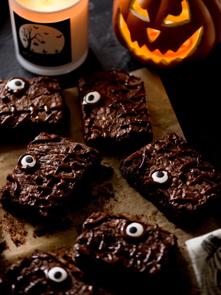 halloween brownies with a towel, candle, and pumpkin