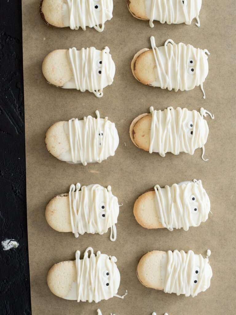 mummy cookies on parchment paper