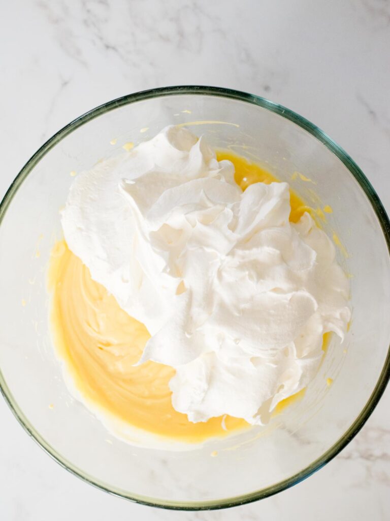 cool whip added to the pudding filling mixing bowl