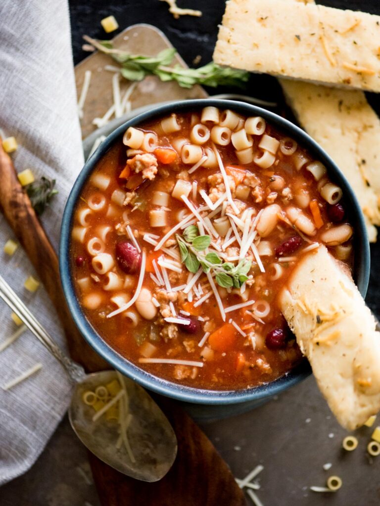 pasta fagioli soup with parmesan and breadstick