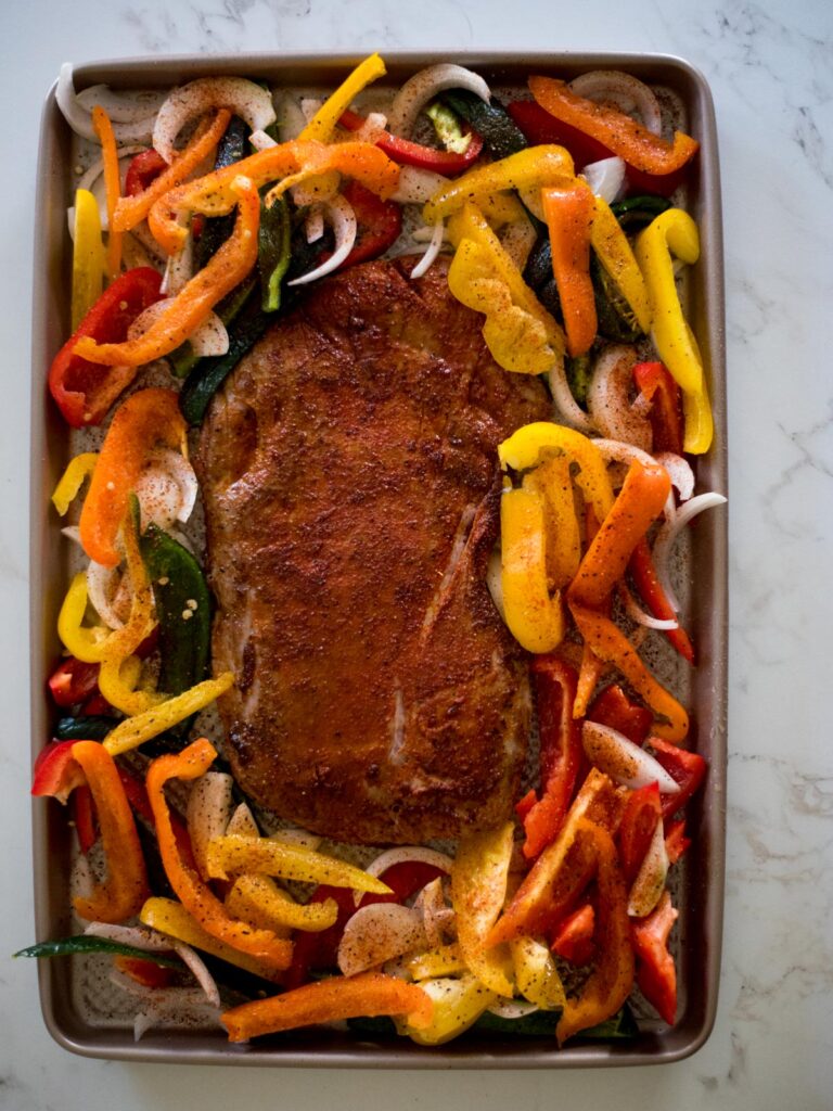 flank steak, bell peppers, and onions and sheet pan