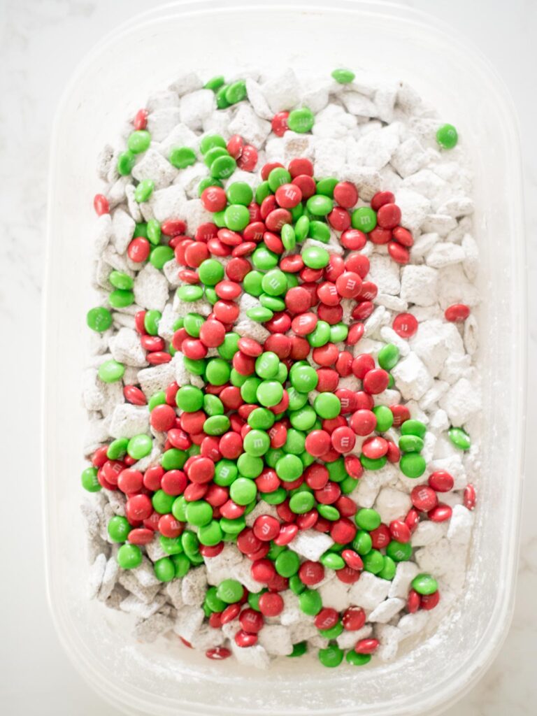 green and red m&m's added to muddy buddies