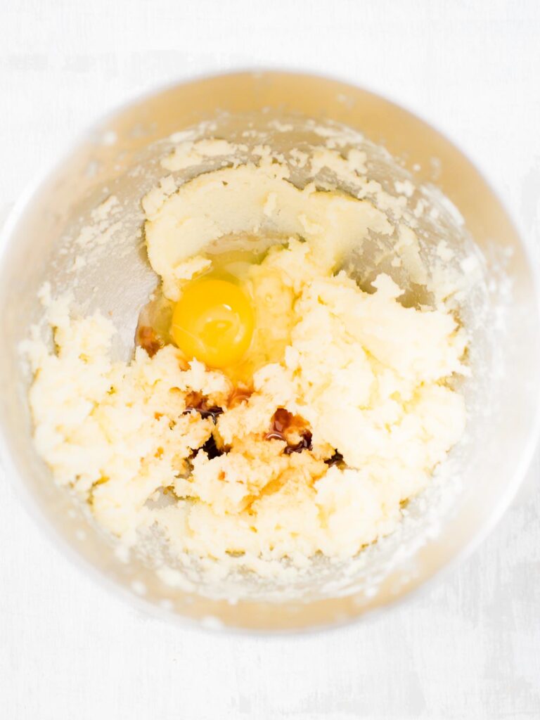egg and vanilla added to the creamed butter and sugar in a mixing bowl