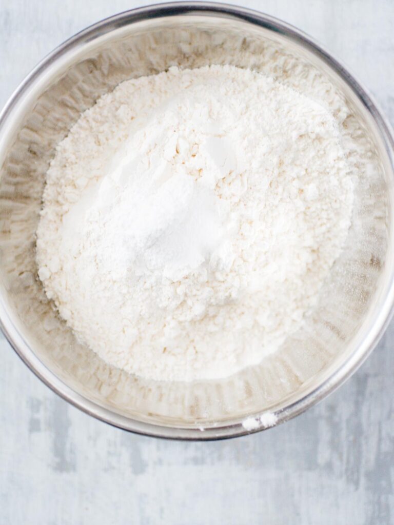 dry ingredients mixed together in a bowl for sugar cookies