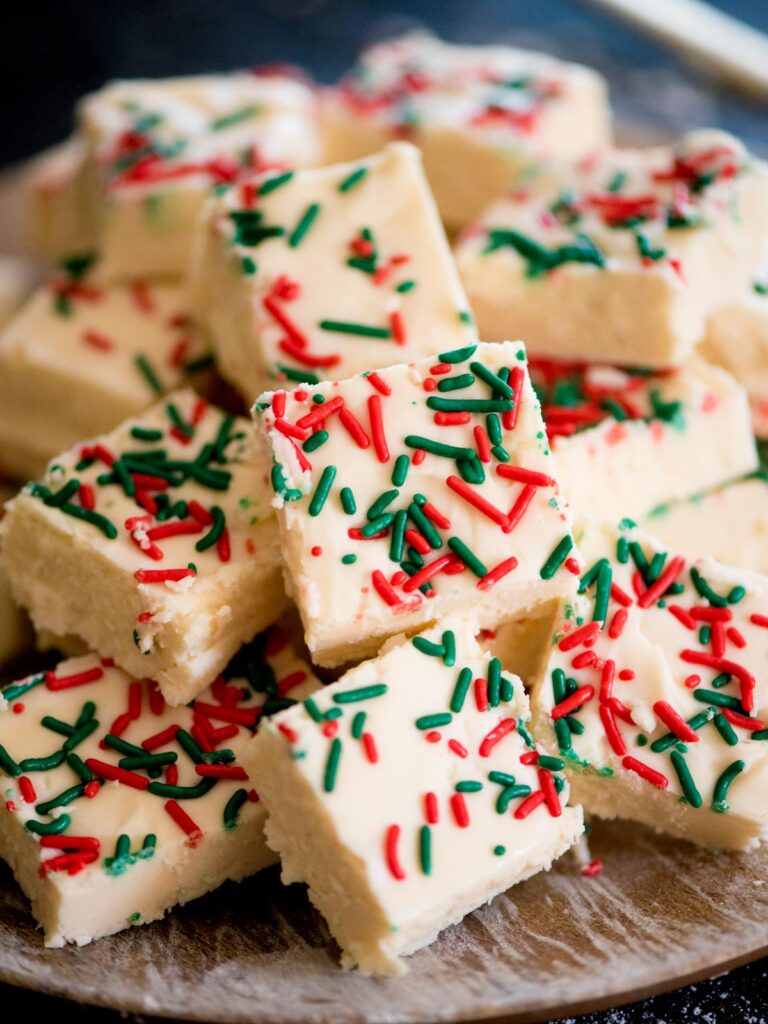 homemade vanilla fudge on a plate with sprinkles