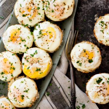 eggs in a basket recipe on a plate with a fork and sprinkled with parsley