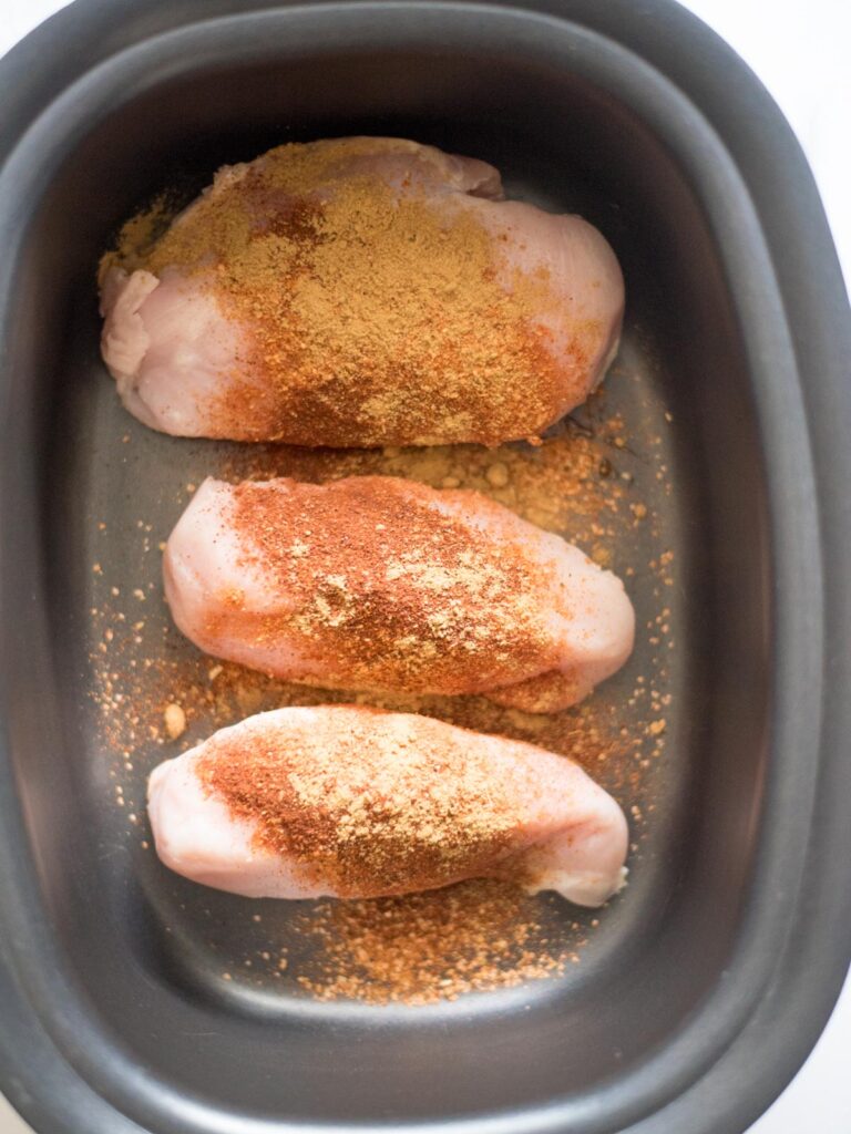 seasoned chicken in a crockpot