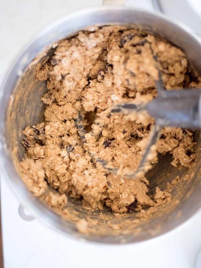 oatmeal raisin cookie dough in a mixing bowl before it's been refrigerated