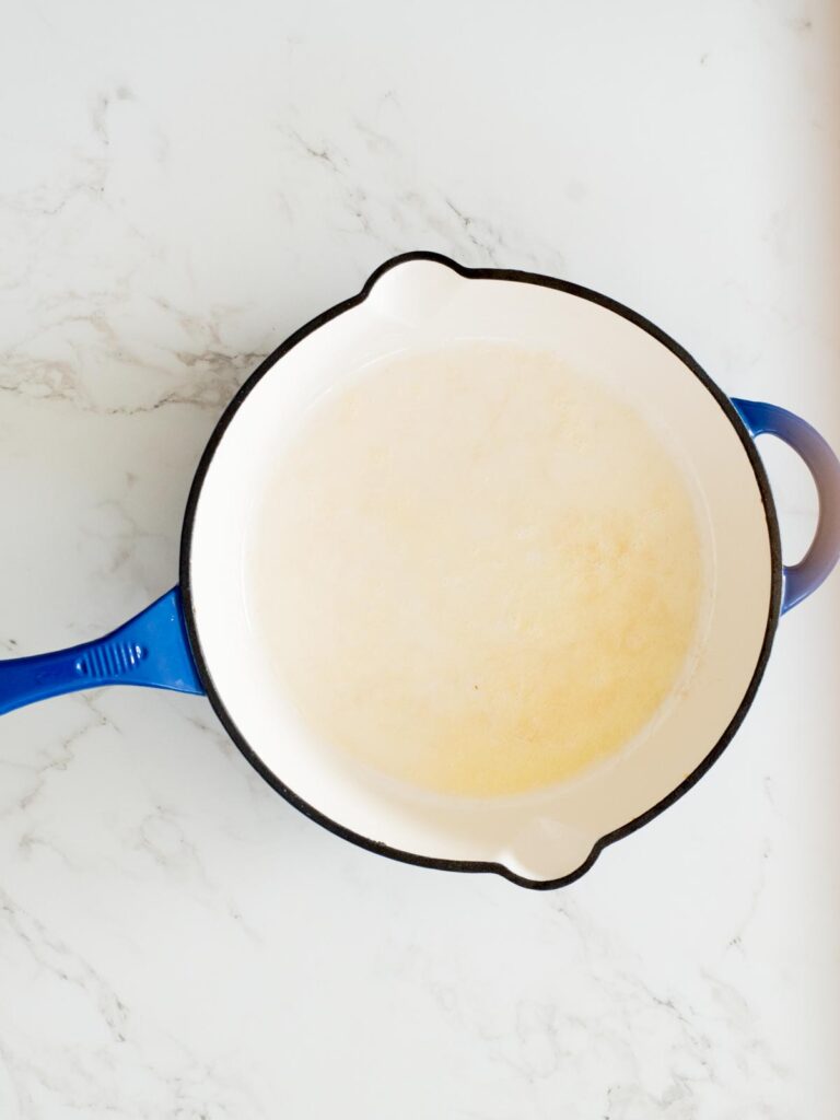 melted butter in an enamel cast iron skillet