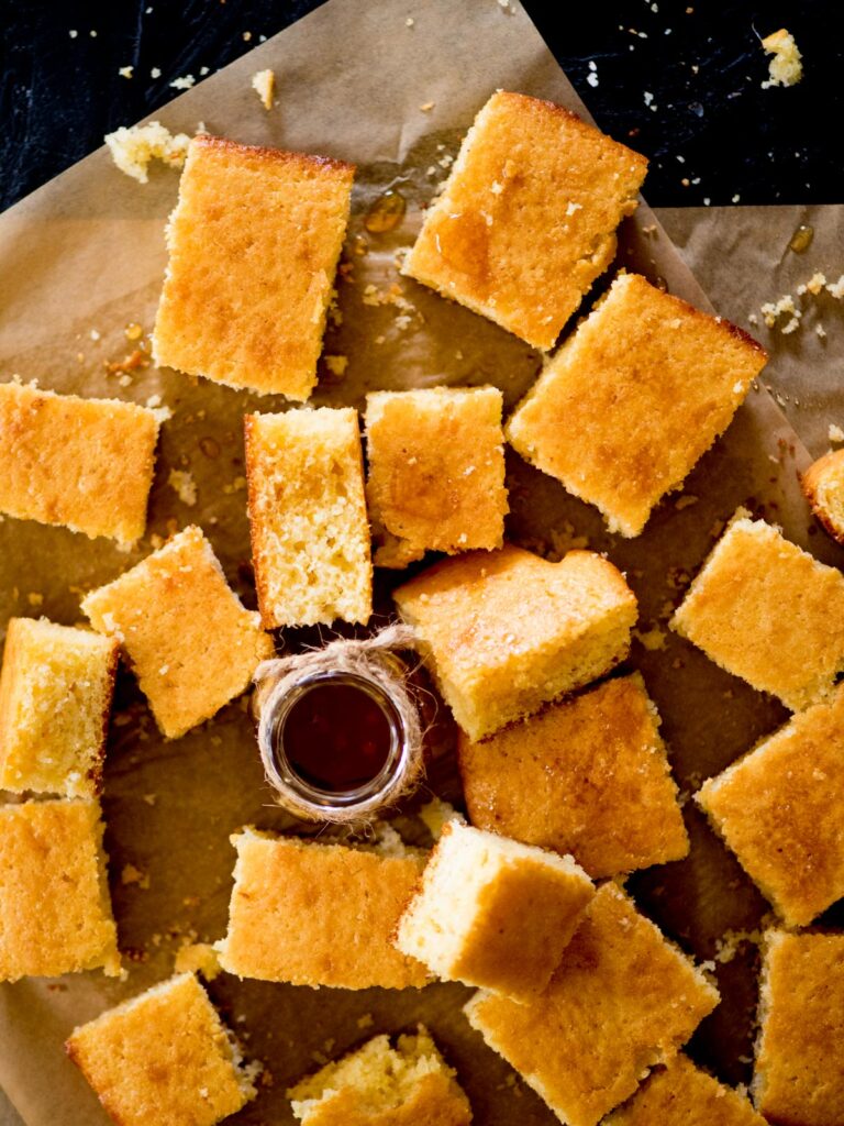 cut cornbread drizzled with honey