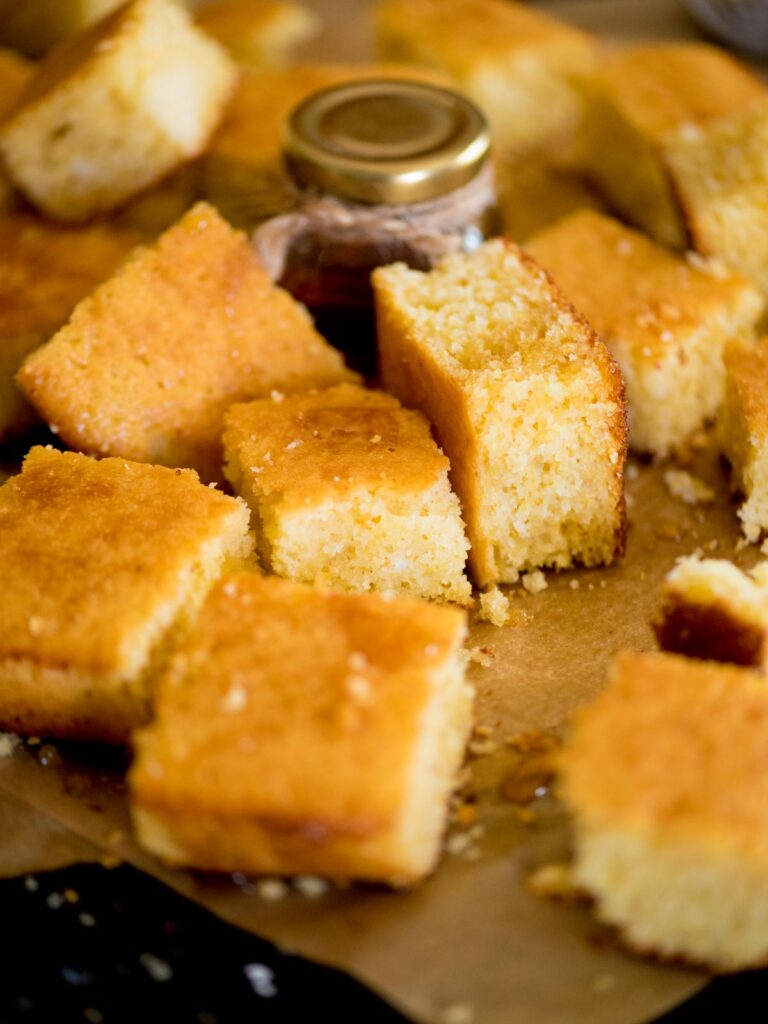 baked cornbread cut into squares and drizzled with honey