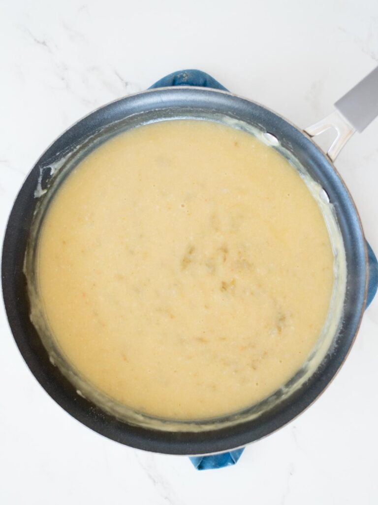 green chile enchilada sauce in a skillet