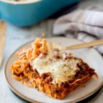oven-baked spaghetti on a plate with a fork
