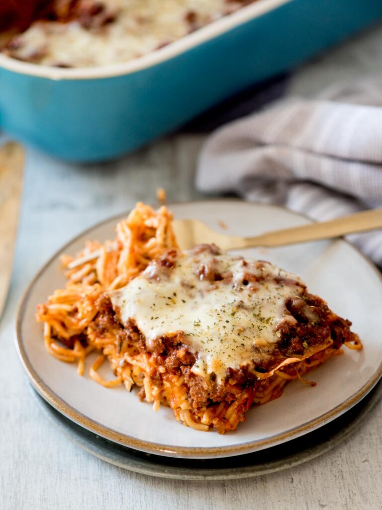 oven-baked spaghetti on a plate with a fork
