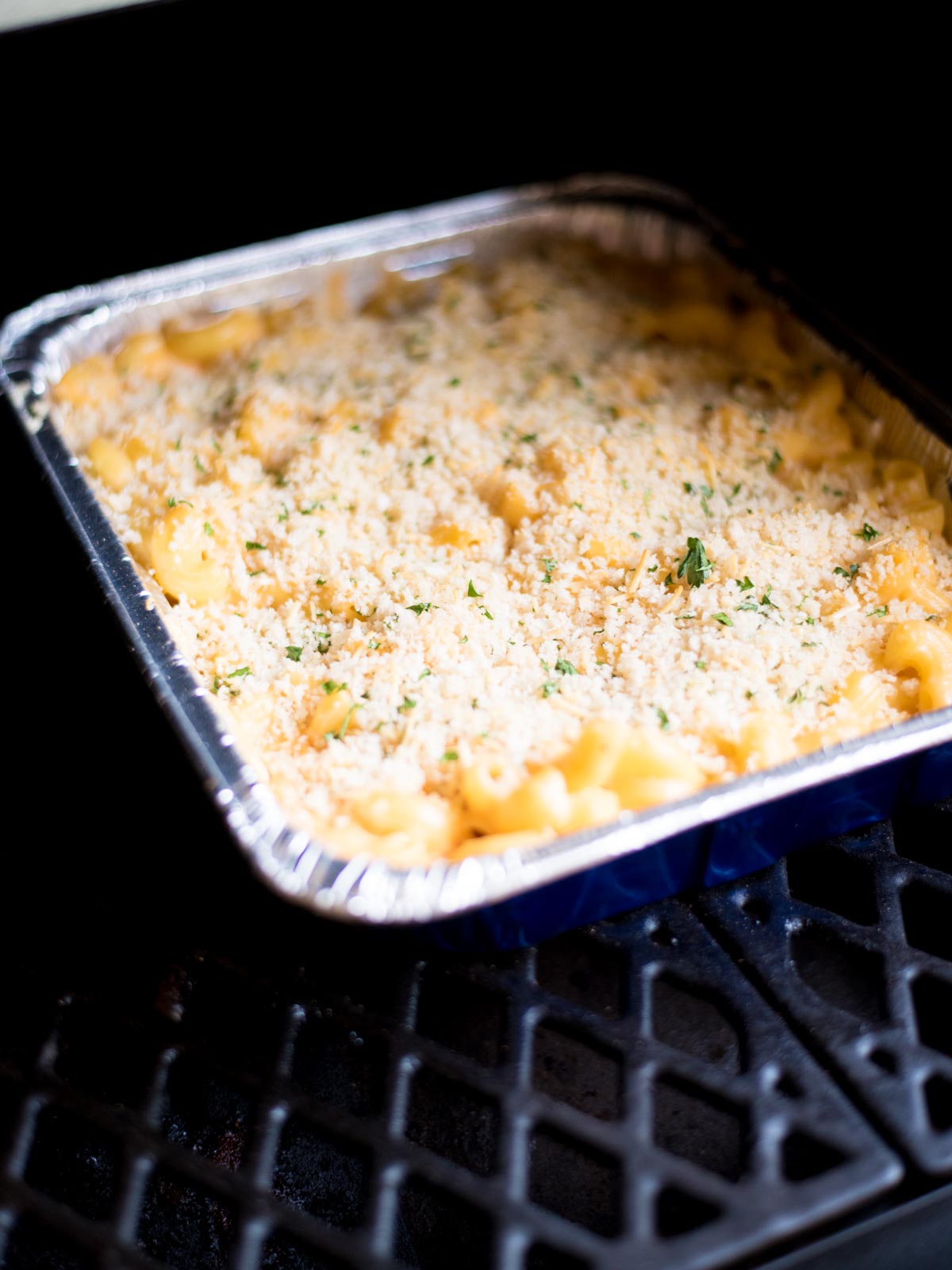 macaroni and cheese in a disposable cake pan inside the pit boss pellet grill
