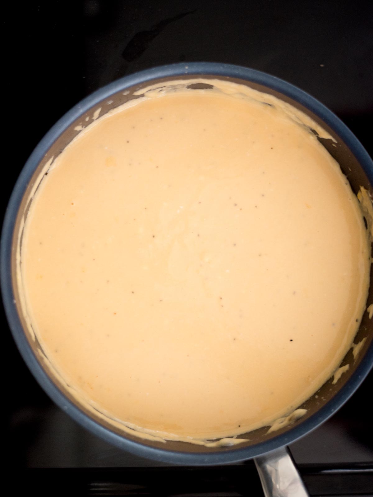 cheese sauce cooking in the skillet