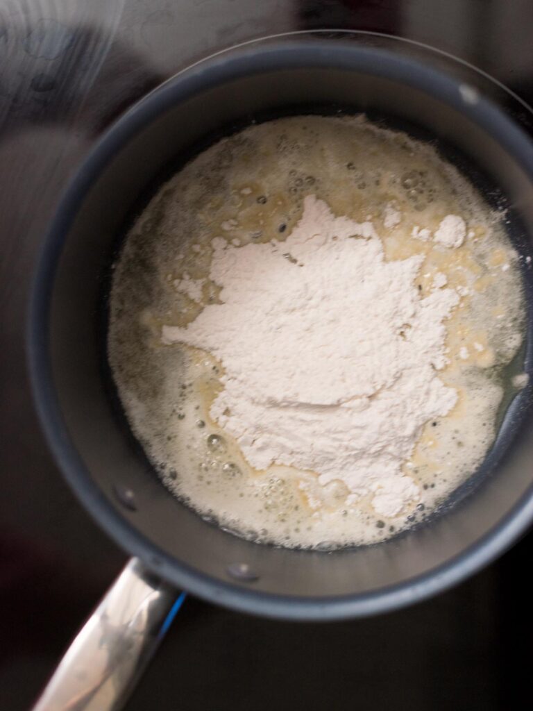 Flour added to melted butter in a saucepan.