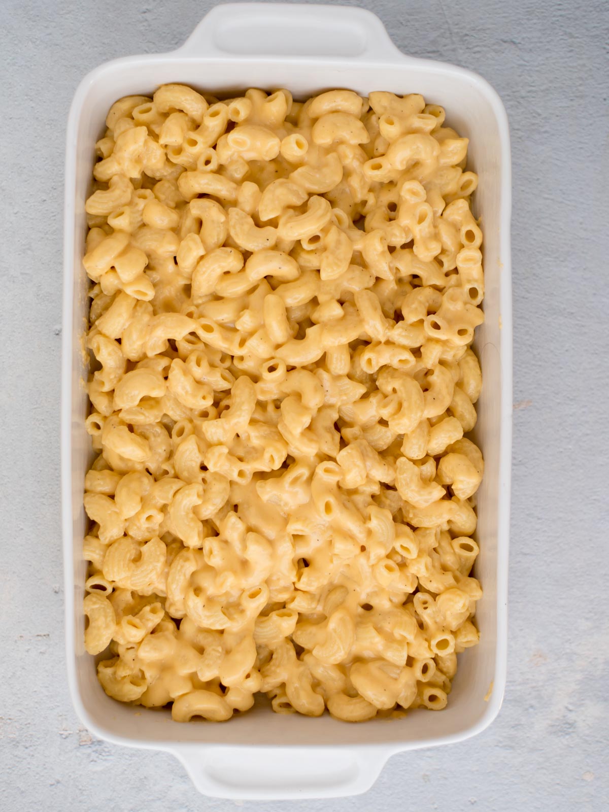 Mac and cheese placed in a baking dish.