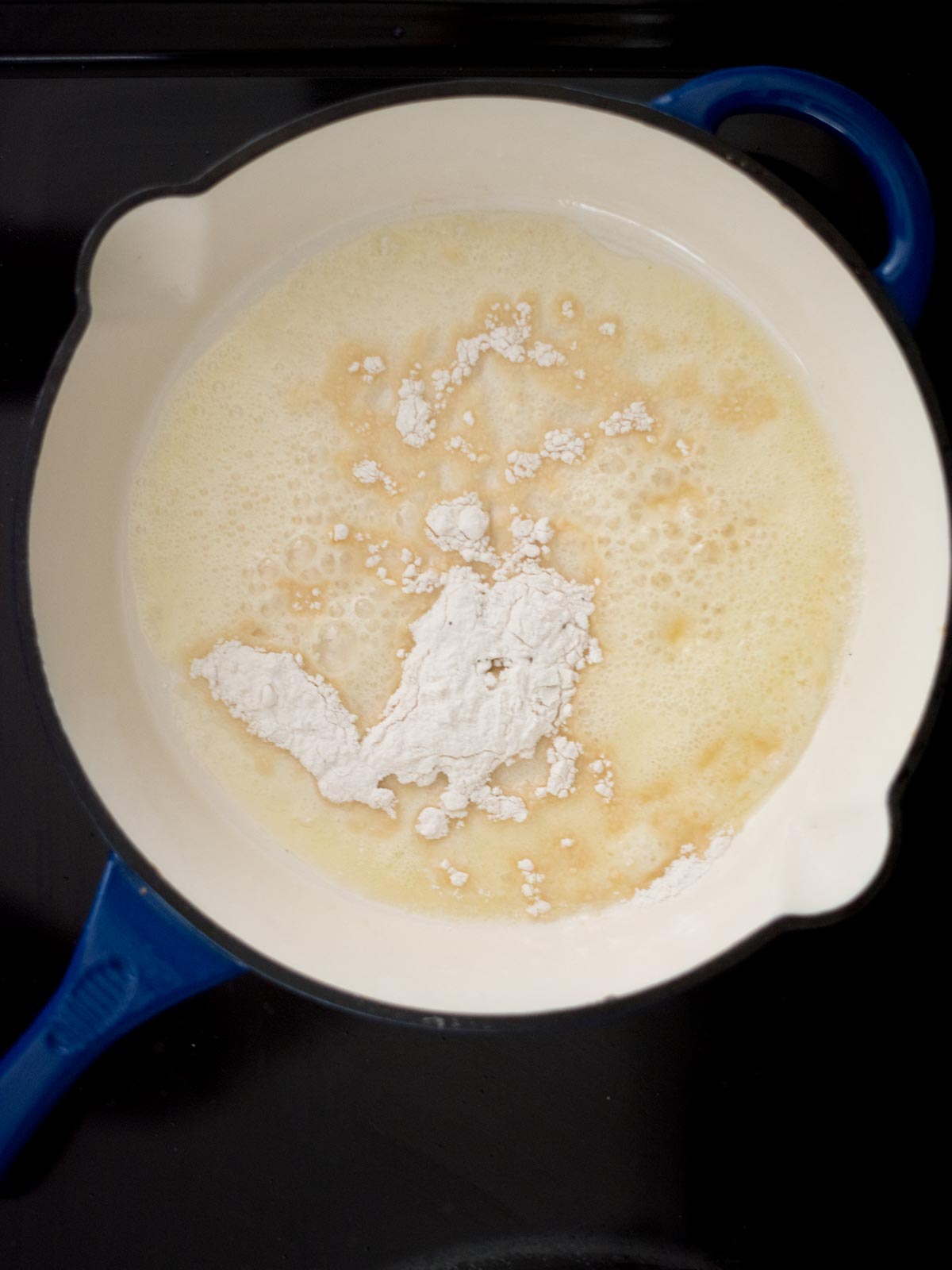 flour added to melted butter in a skillet on the stove