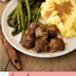 french onion meatballs served on a plate with mashed potatoes and roasted green beans on a pinterest image