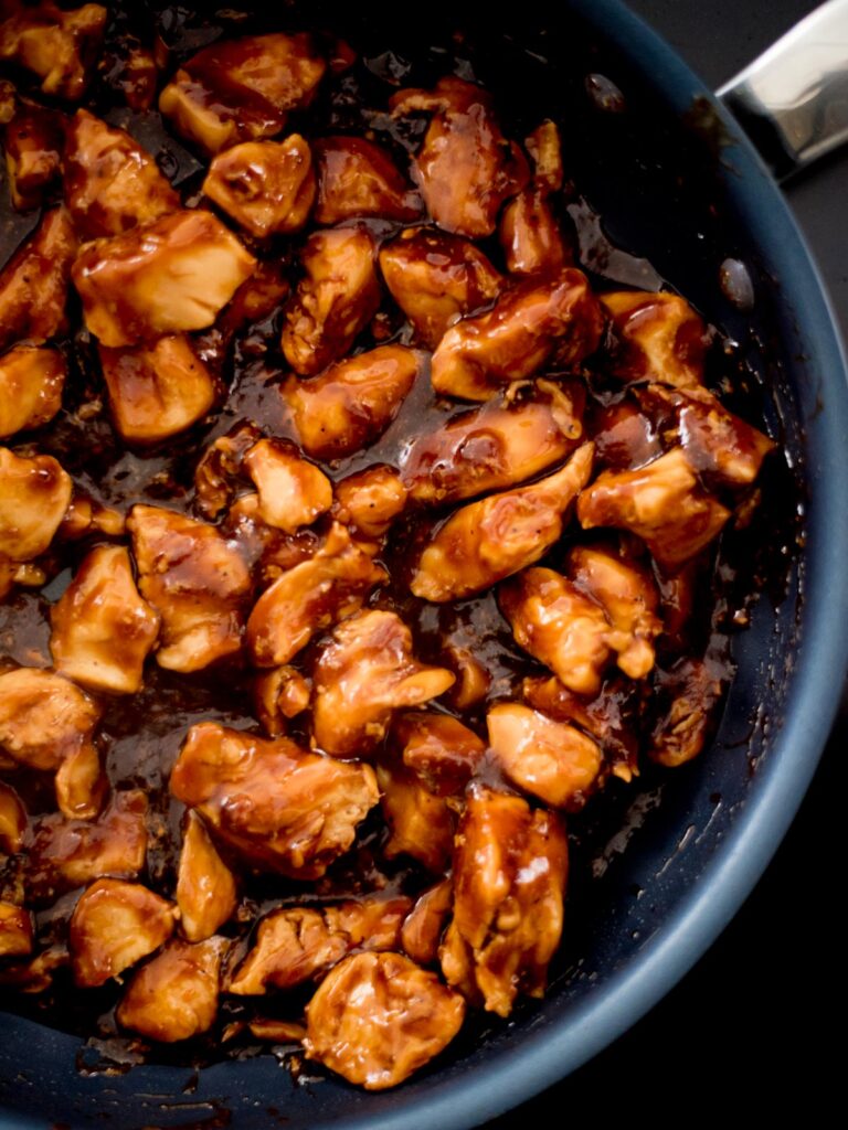 Close up of the cooked chicken breast chunks cooked in the General Tso chicken.