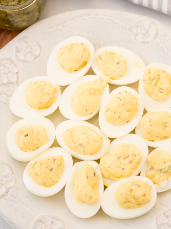 Southern Deviled eggs served on a white decorative serving platter.