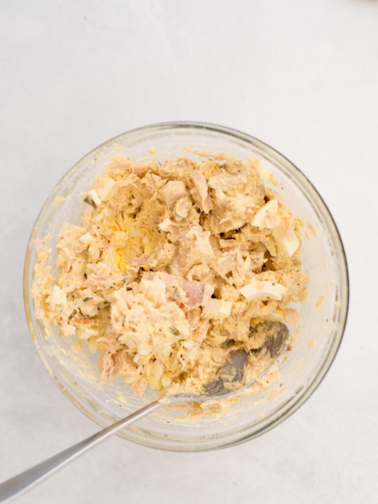 Tuna salad combined in a mixing bowl.