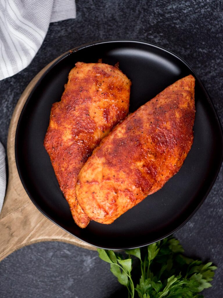 Top view of whole smoked chicken breasts.
