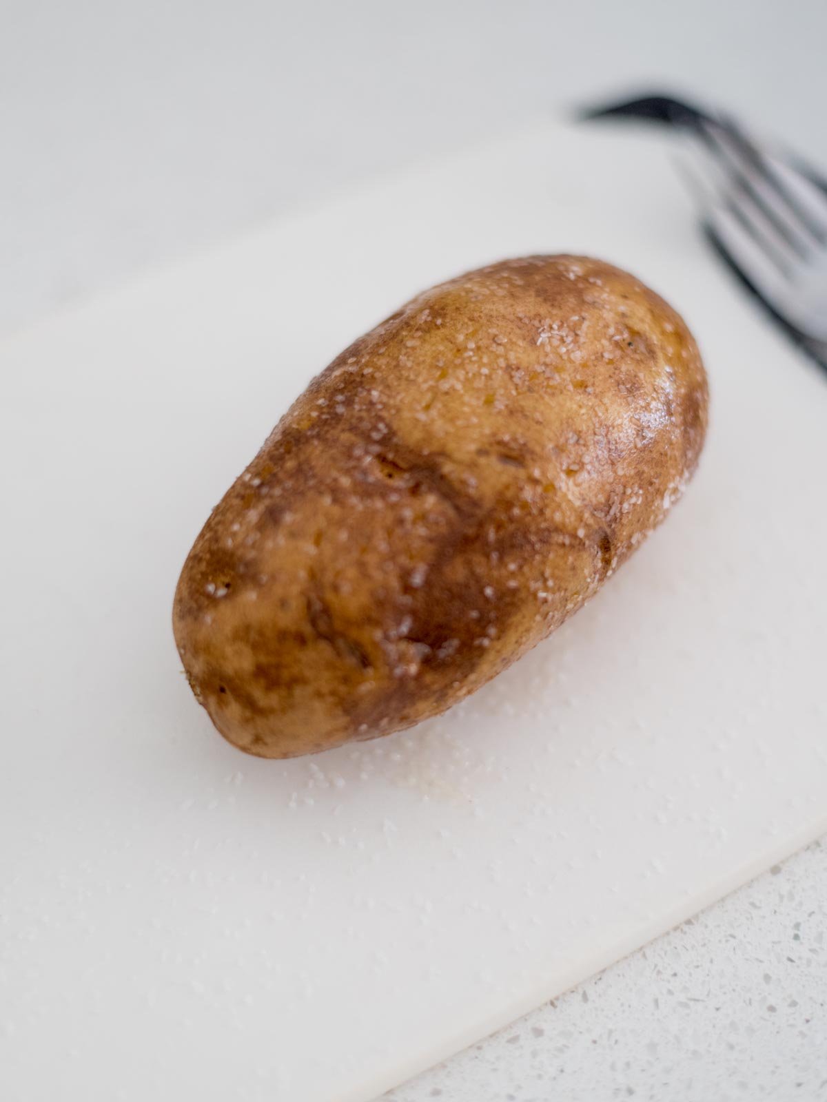 A whole potato rubbed with oil and salt.