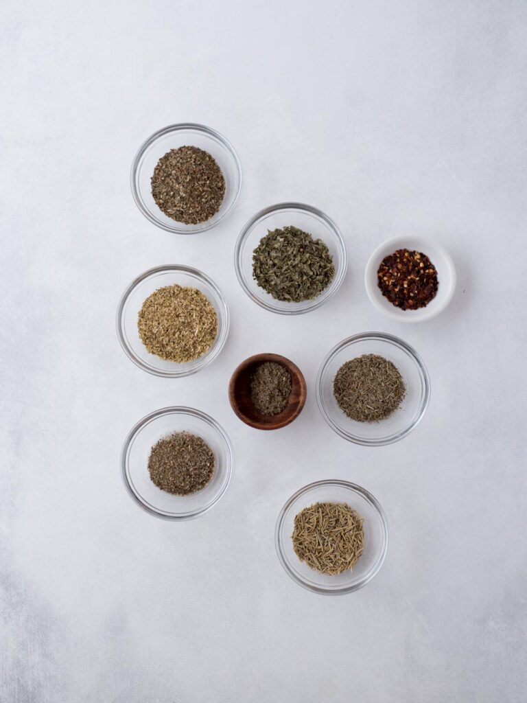 Ingredients needed to make homemade italian seasoning.