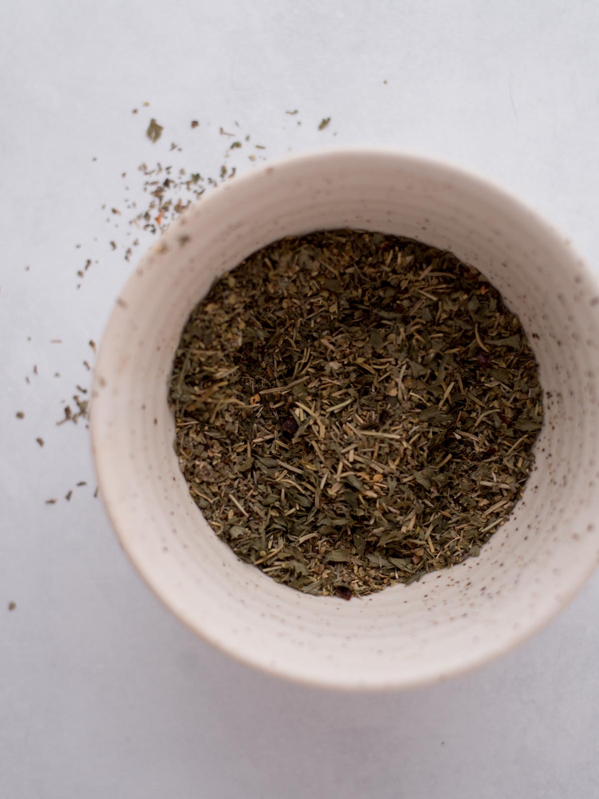 Homemade italian seasoning combined in a bowl.