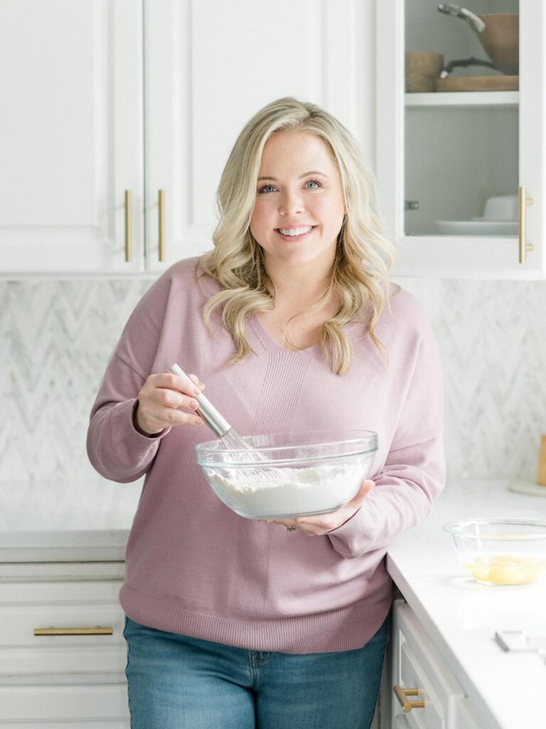 kara myers holding a mixing bowl with a whisk