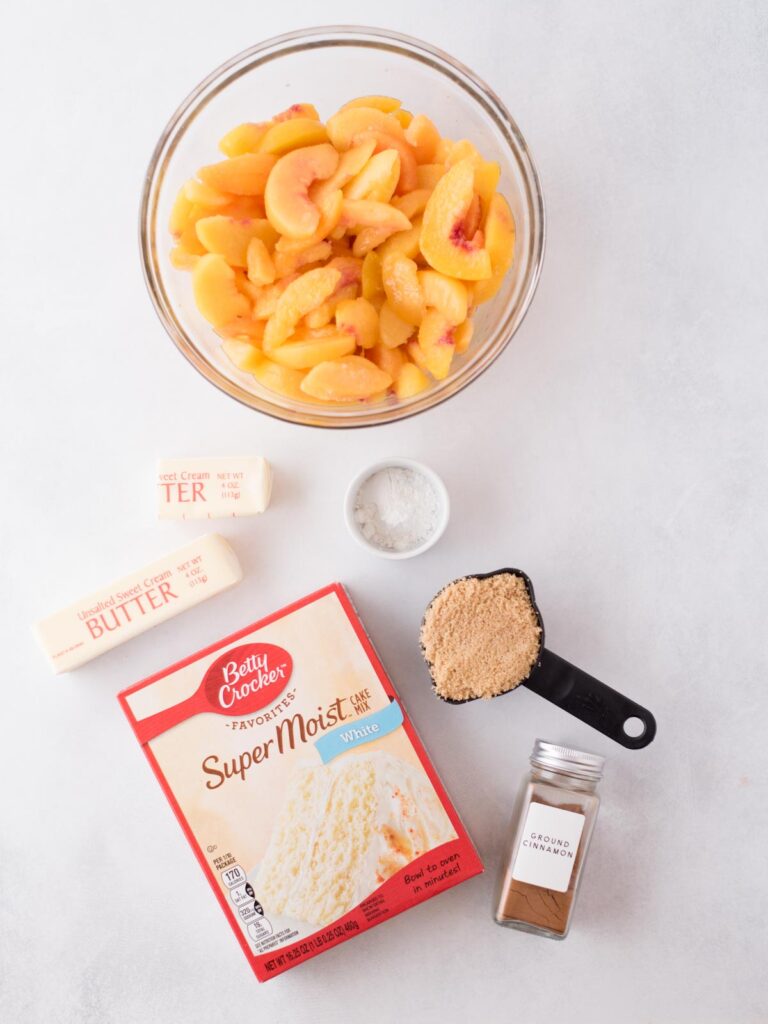 Ingredients needed to make peach cobbler with a cake mix.