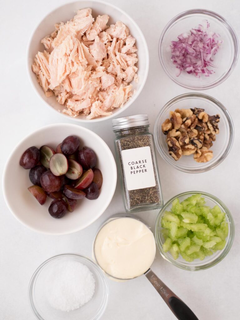 Ingredients shown are used to prepare chicken salad with grapes.