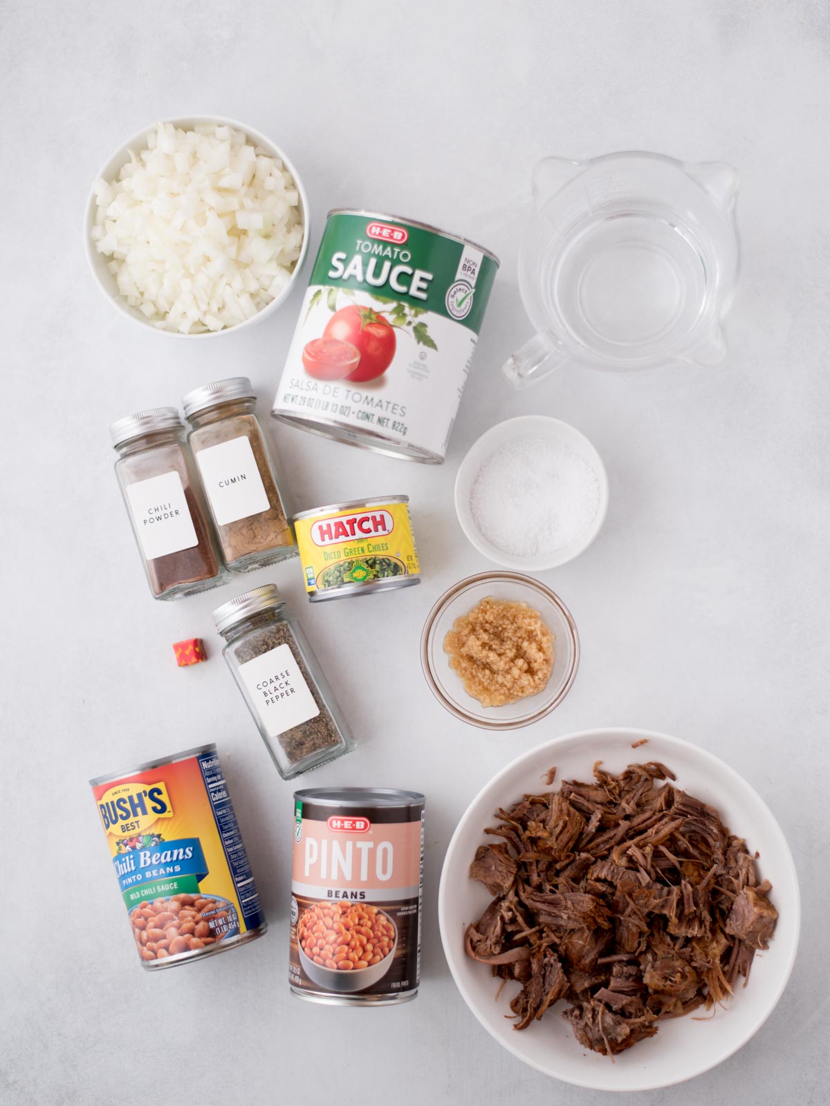 all of the ingredients to make this brisket chili recipe laid out