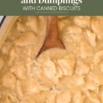 A wooden spoon rests in a pot of chicken and dumplings with biscuits, topped with the text Easy Chicken and Dumplings WITH CANNED BISCUITS.
