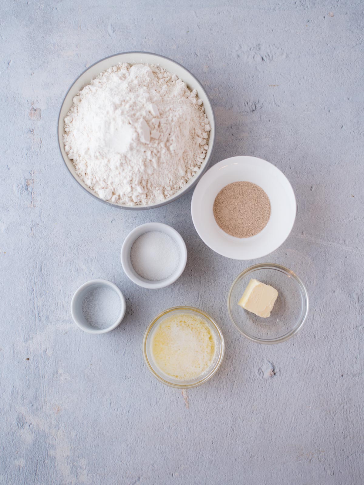ingredients for homemade yeast rolls in bowls