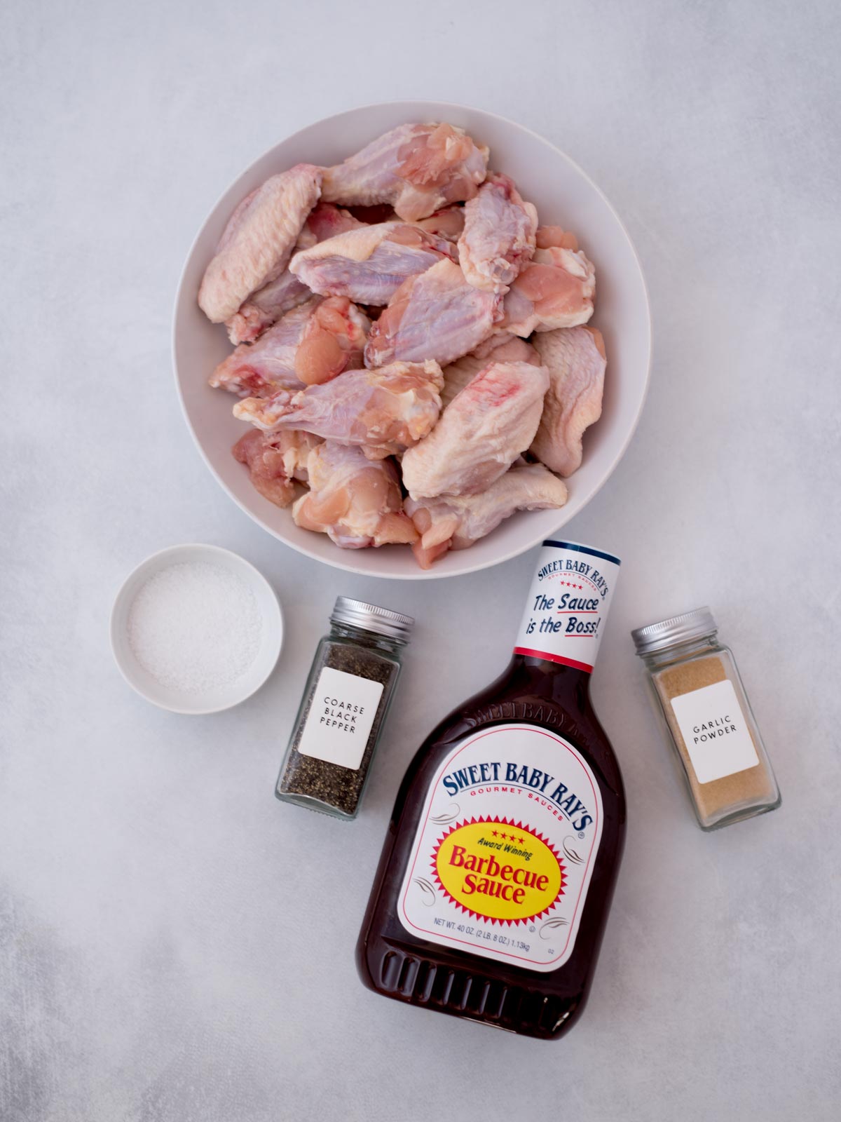 Ingredients shown are used to prepare bbq chicken wings in the crockpot.