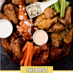 pinterest image of a chicken wing charcuterie board surrounded by a dish towel with a text overlay that says "the best chicken wing charcuterie"