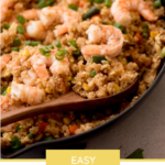 pinterest image of shrimp fried rice in a skillet with a wooden spoon and a text overlay that says "easy shrimp fried rice"