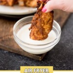 air fried chicken tenderloins being dipped in ranch in a bowl with text overlay that says air fryer chicken tenderloins